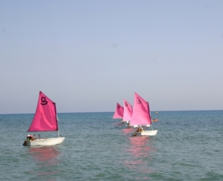 Discover the Corsican coastline aboard an Optimist